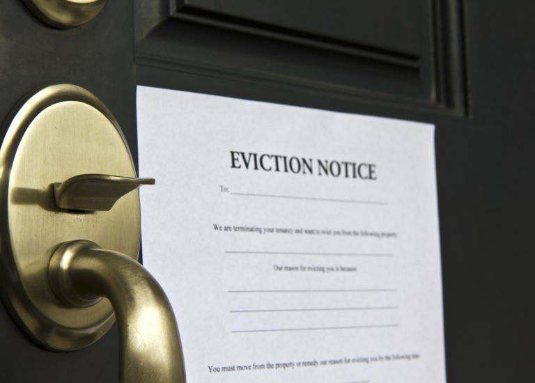 A Winter Eviction Notice Posted on a Door in Ontario