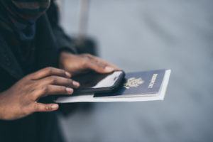 A citizen holds their passport and wonders what will happen after their divorce