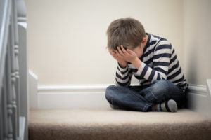 A child reacting due to parental alienation following a divorce