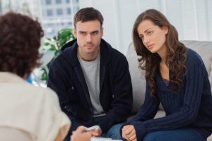 A divorcing couple in divorce mediation